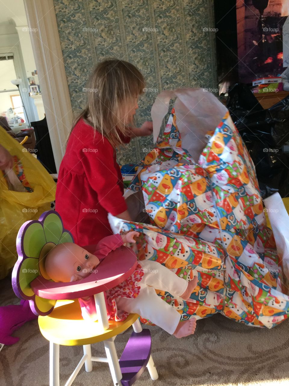 Young child with Down ah crime opening Christmas presents