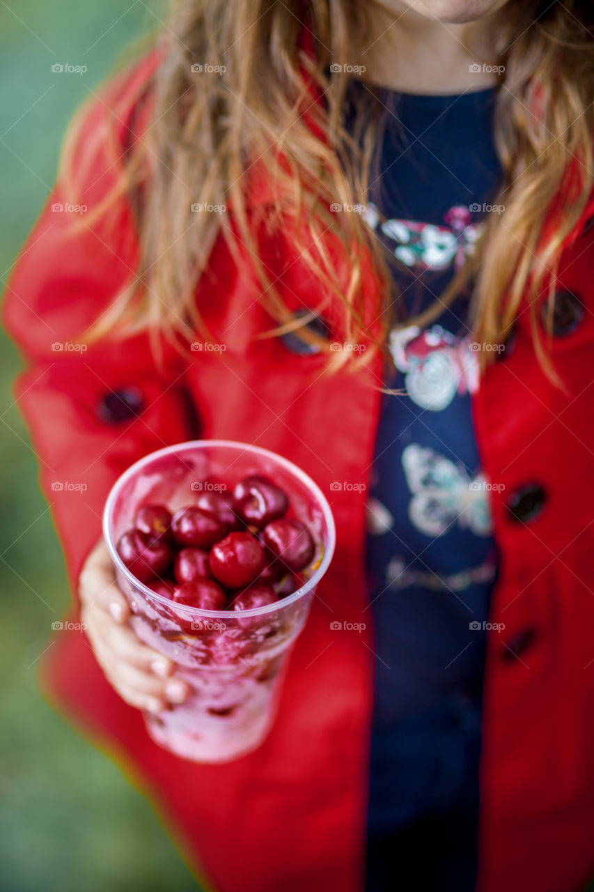 Girl eating cherry  