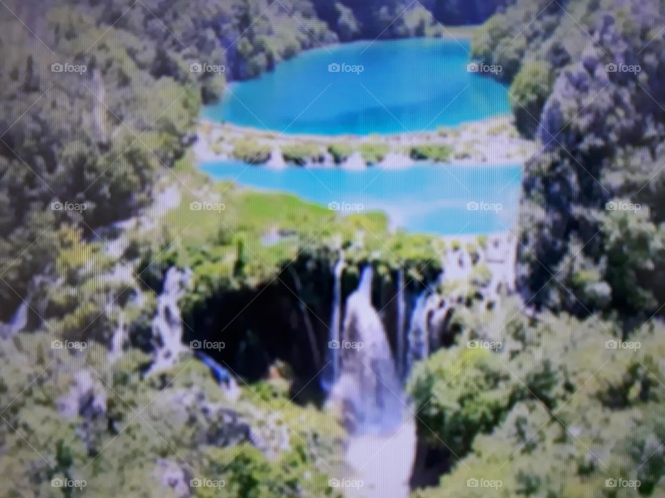 Nature takes its course Two natural pools in the color of blue water with a beautiful waterfall