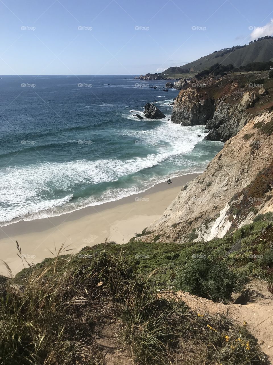 An escape from reality, time and space with a glance across the jagged cliffs and crashing waters of the California coastline. 