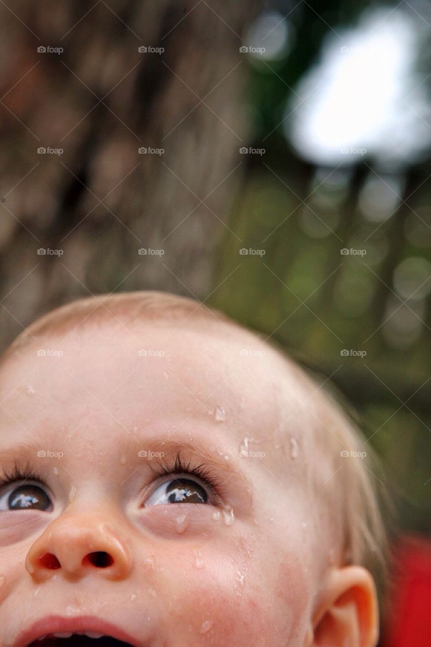 Toddler playing in the water.