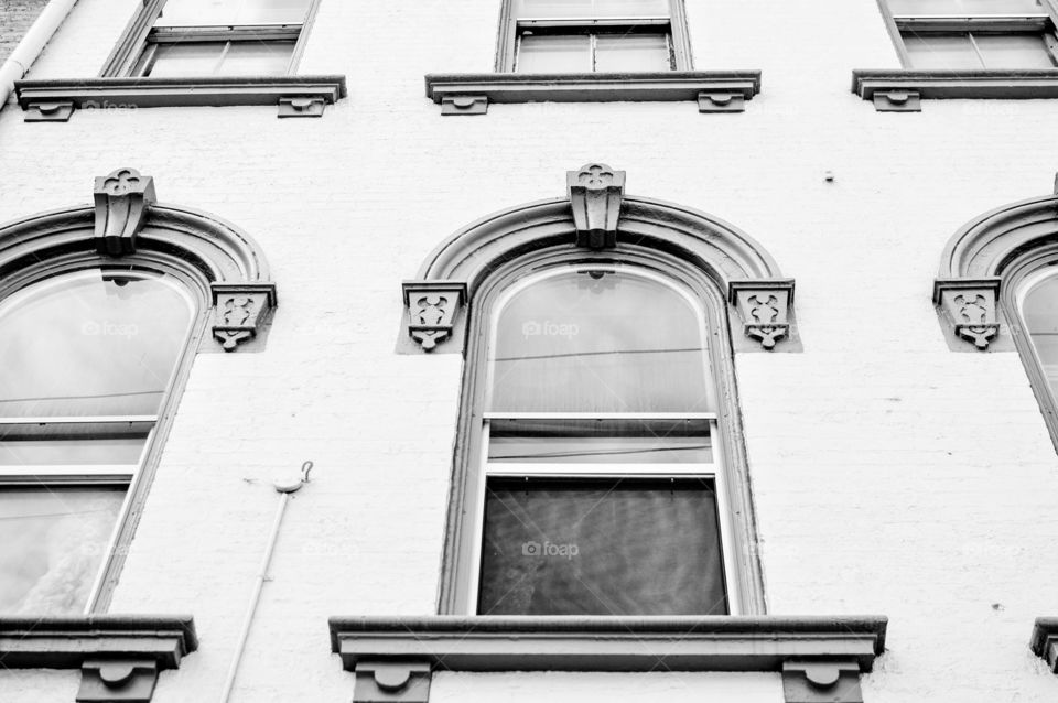 Black and white image of old architectural windows