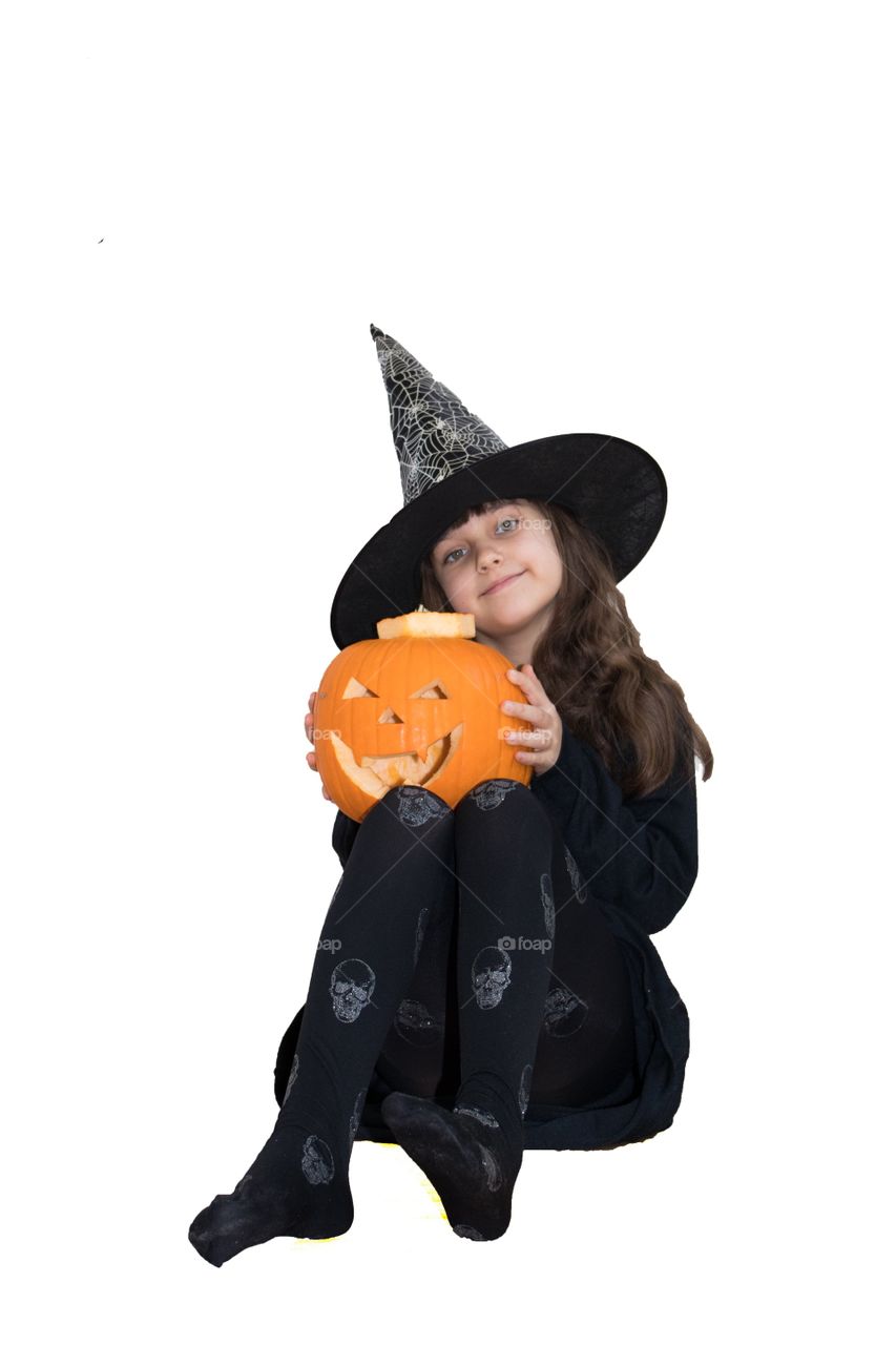 A girl in a costume for Halloween with pumpkin 