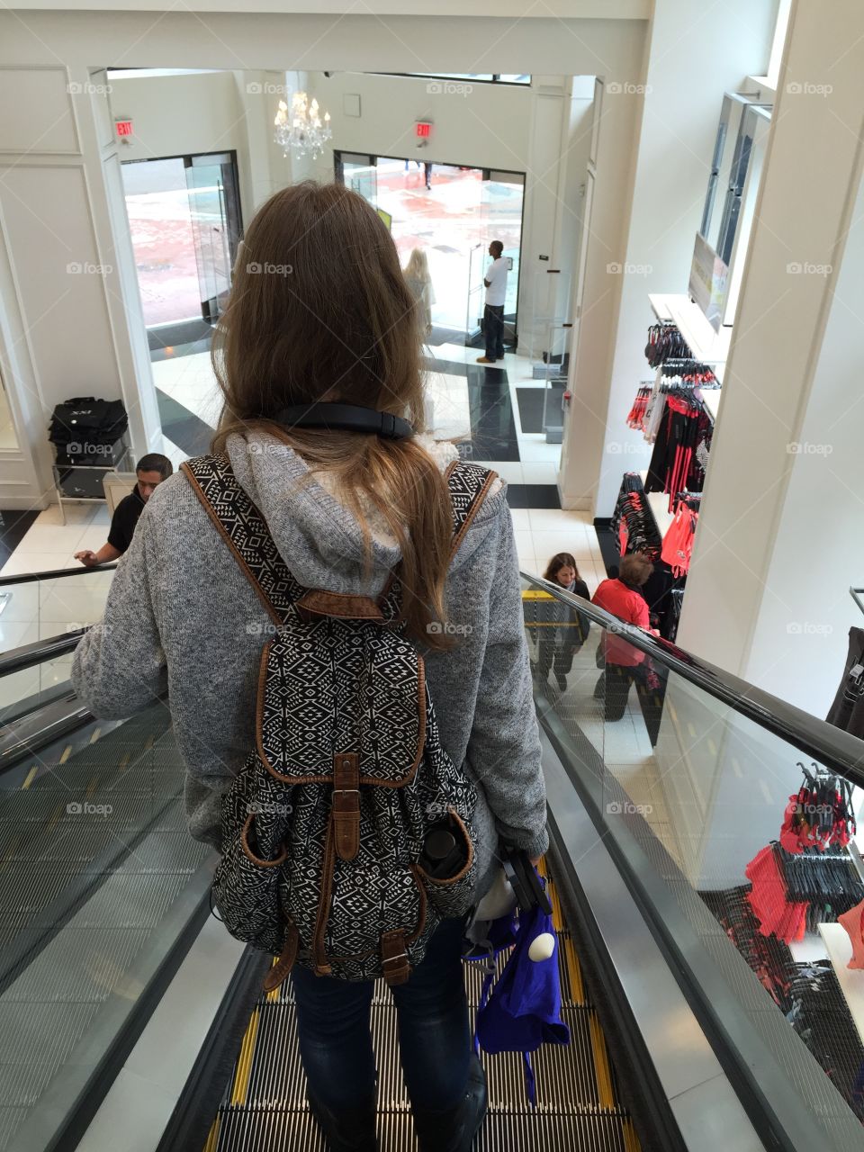 Teen girl is at the clothing store