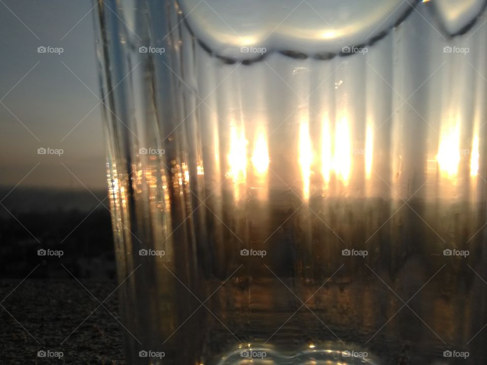 sunrise showing in side the glass