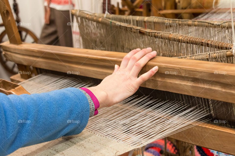 A woman working on a loom