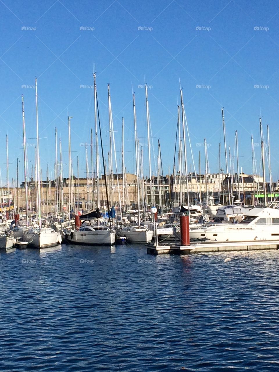 Boats in the harbour - sunny summer day in France. Not a cloud in the sky. The great outdoors. 