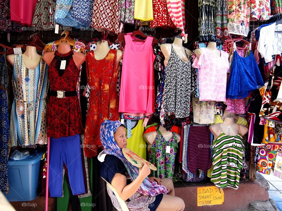 lady selling colorful clothes