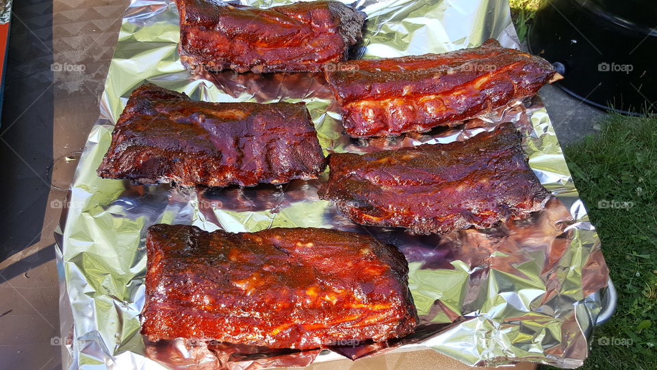 half racks of ribs after pulling off Weber grill