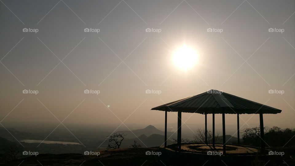 beautyfull early sunset sunshin on top of mountain hut view