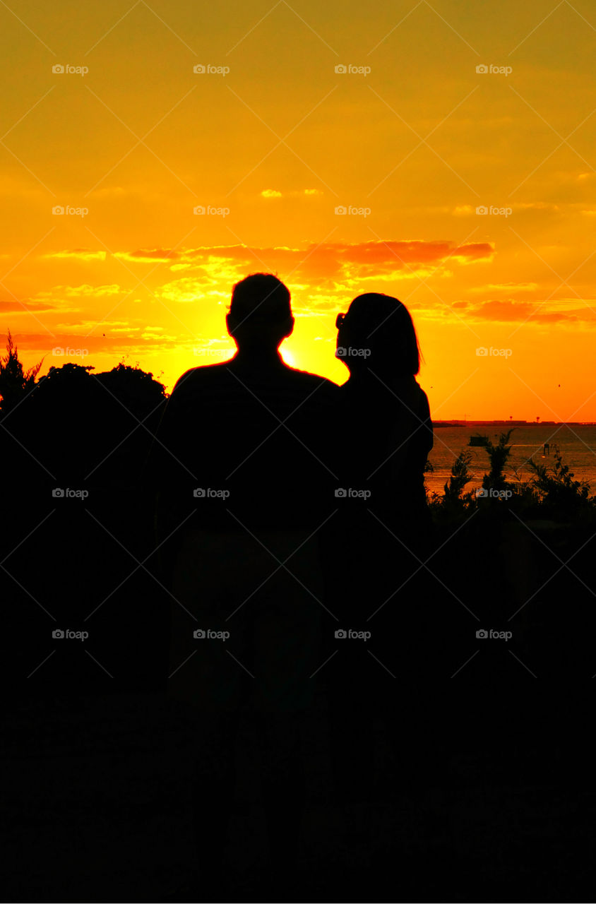 Amazing Silhouettes! Like the meeting of two worlds - the known and the unknown. The sun is like a great big romantic, inspirational fire in the sky. Brilliant streaks of yellow, orange, gold, blue, pink and red overcome the blue and purple of the sky. The sky resembled a prism; all the colors blended perfectly together. It's as if the colors and intensity of the light is just right! My work is done for today. I'm not sure what tomorrow will bring, but I'll be prepared for it!