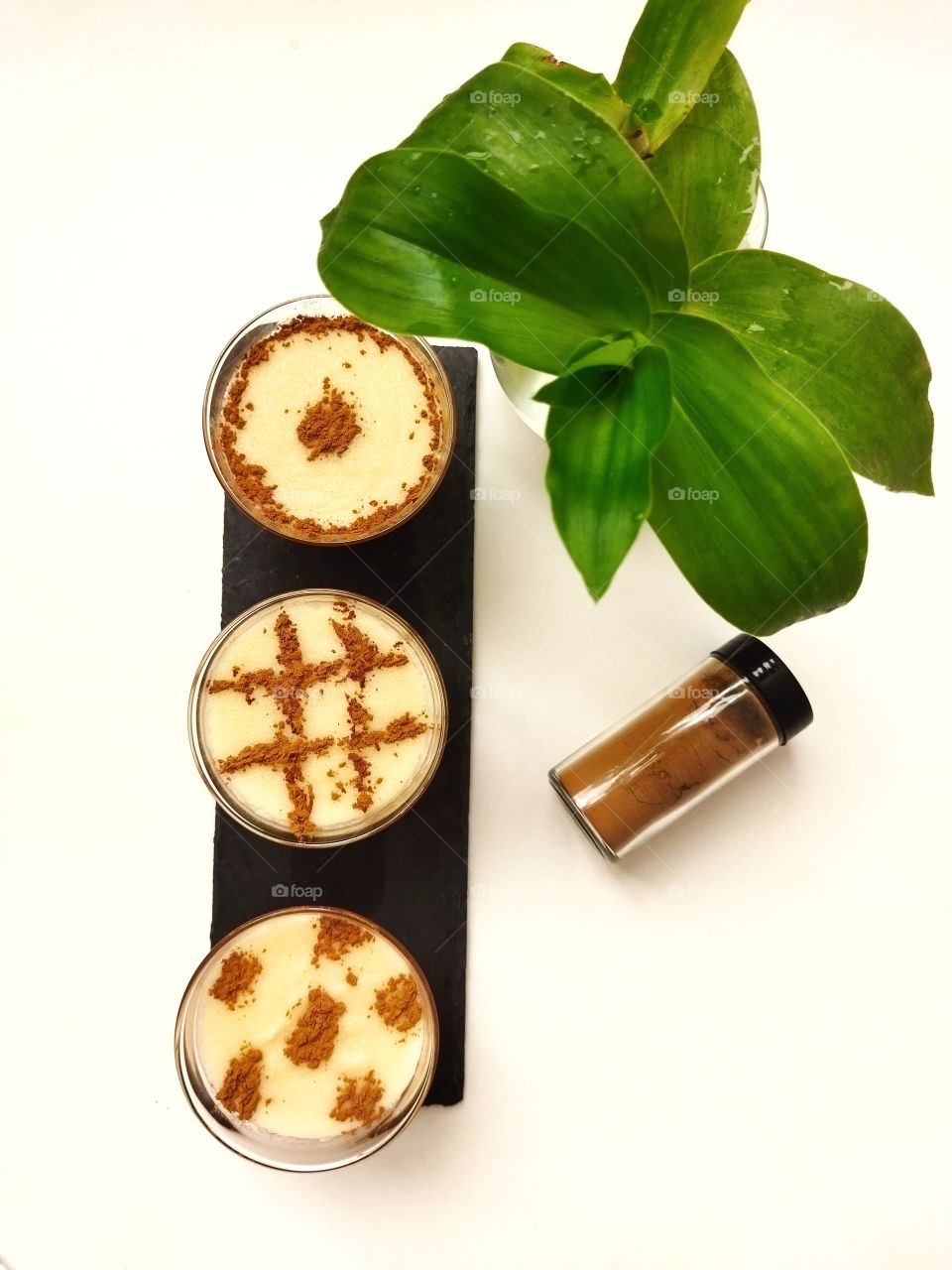 Arroz con leche. Rice pudding with cinnamon isolated on white background.