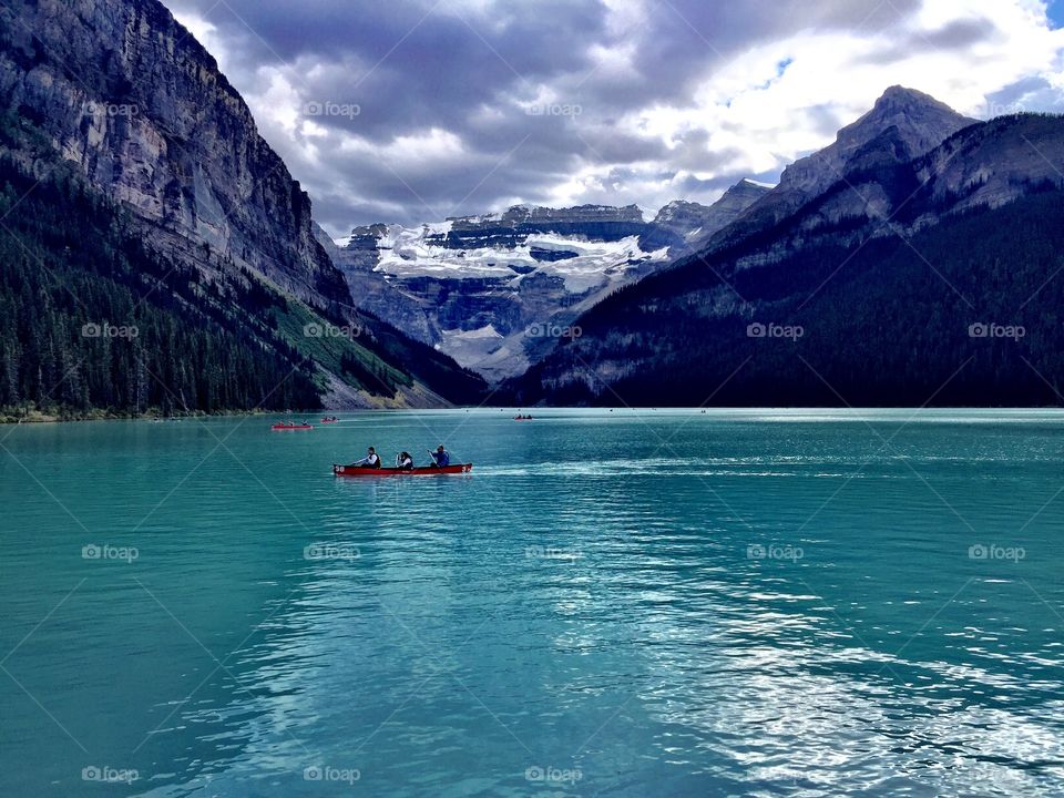 Red canoe on lake