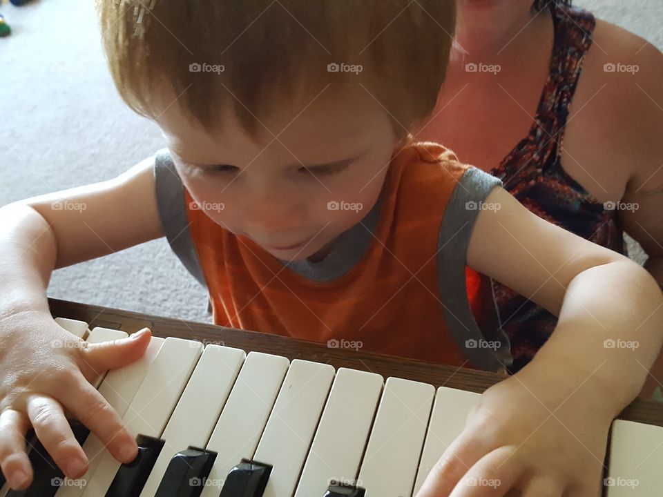 child playing piano