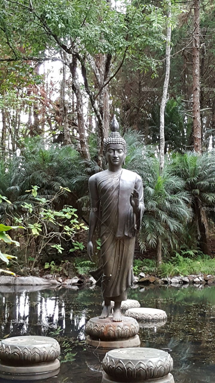 Buddha sculpture in the forest