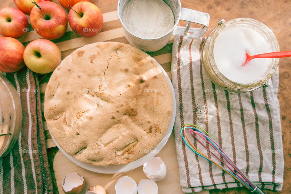 Making homemade puffed apple pie with eggs, sugar and flour.