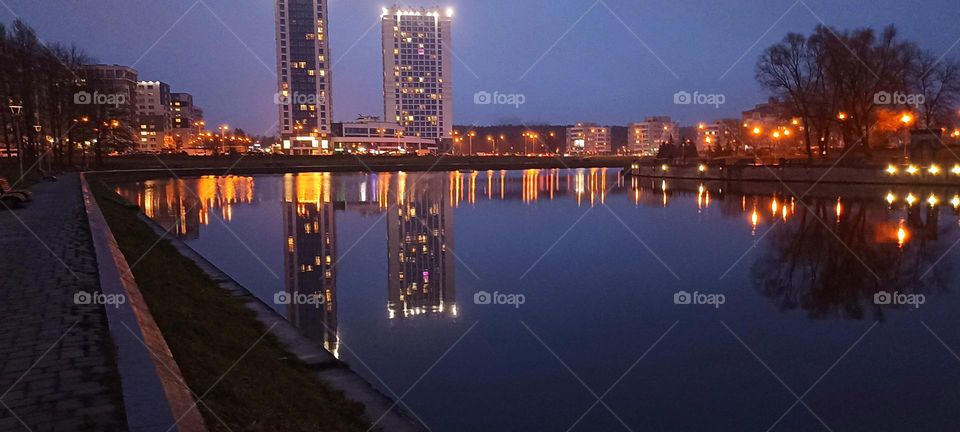 beautiful night light street view, windows magic light, cityscape and reflection in water