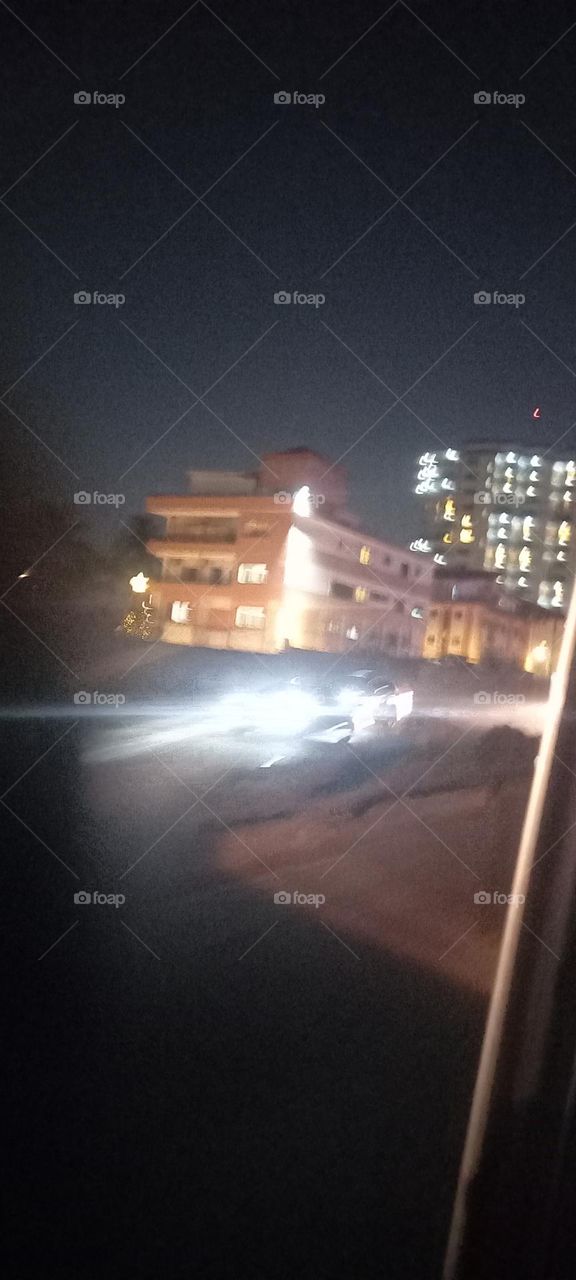 Twinkling windows , the beauty of evening light. Bask in the beauty of evening light with the view of light twinkling from these windows at night