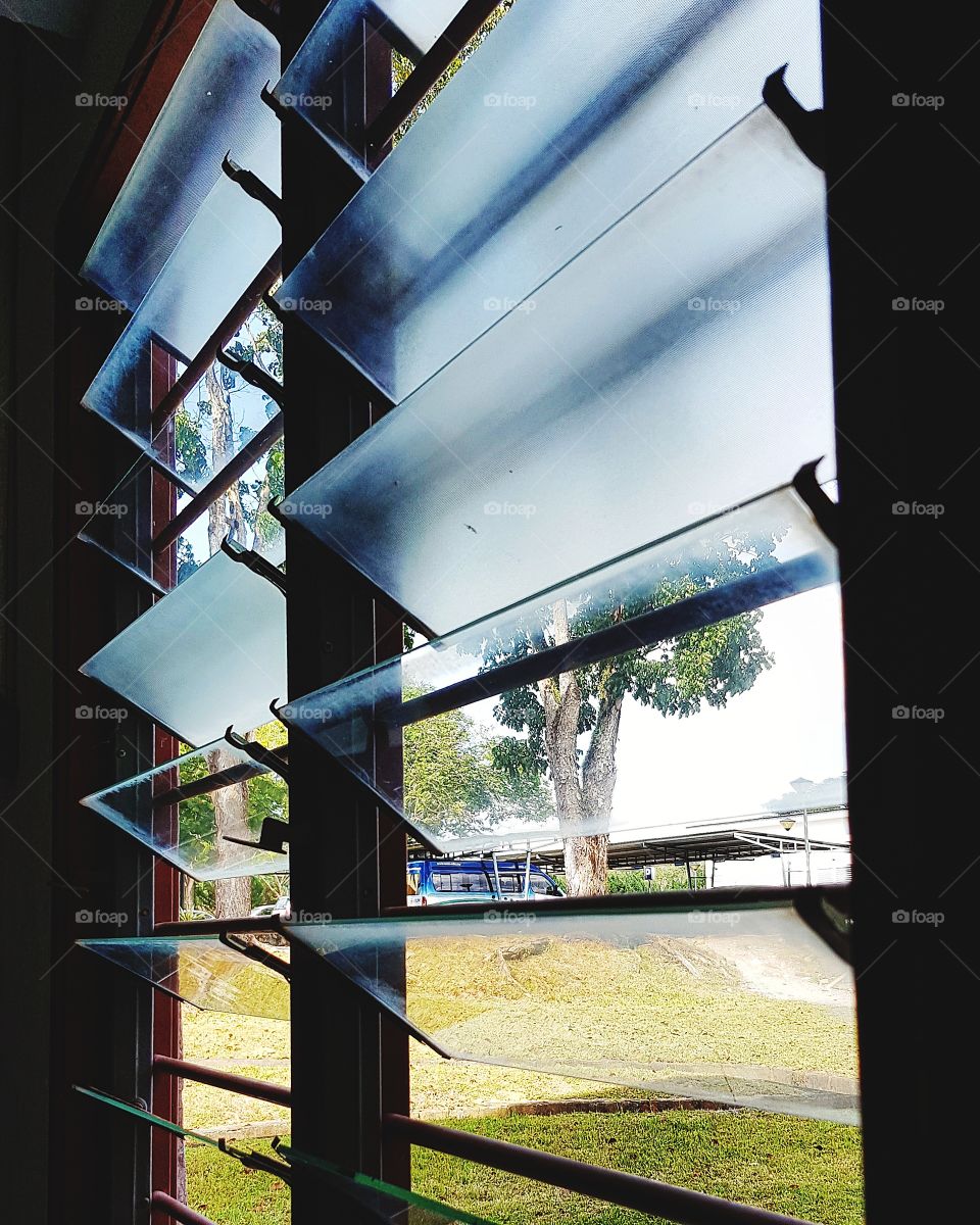 Glass louver at window