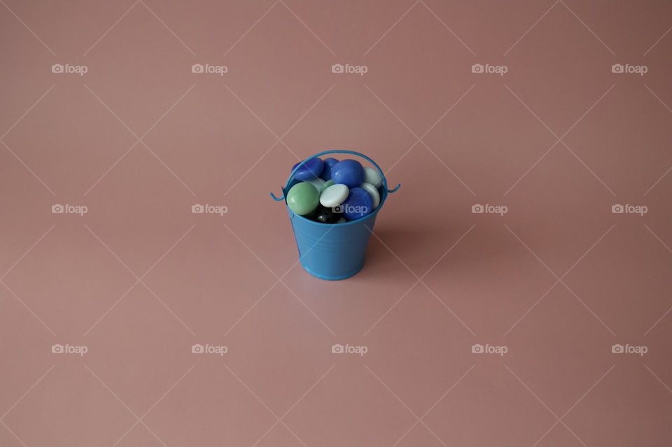 Bucket with pebbles
