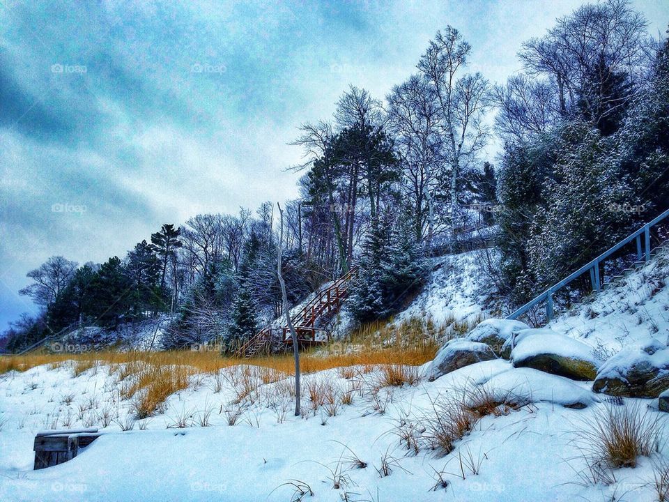 Snowy beach scene in Manistee