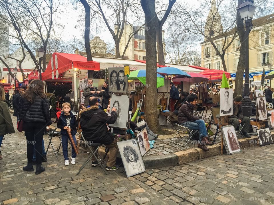 Painting artist at  Sacré-Cœur in Paris France. Famous square with artists.