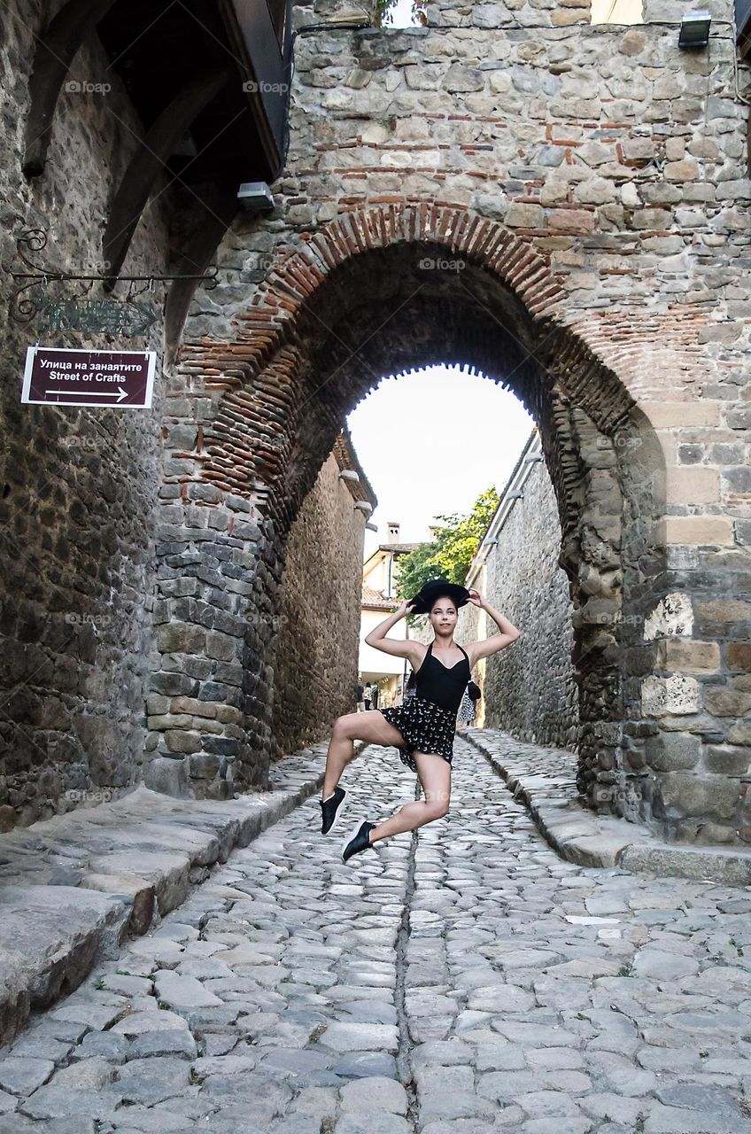 Young Female Ballerina Dancing Outside