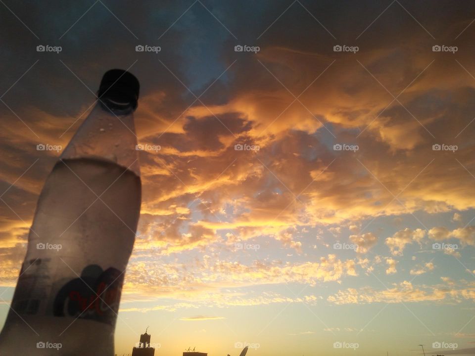 Scenic sky and a bottle embraces high sky.