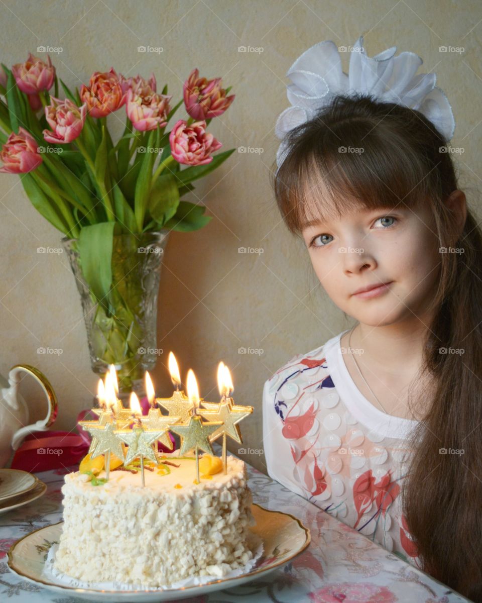 Portrait of a girl with birthday cake