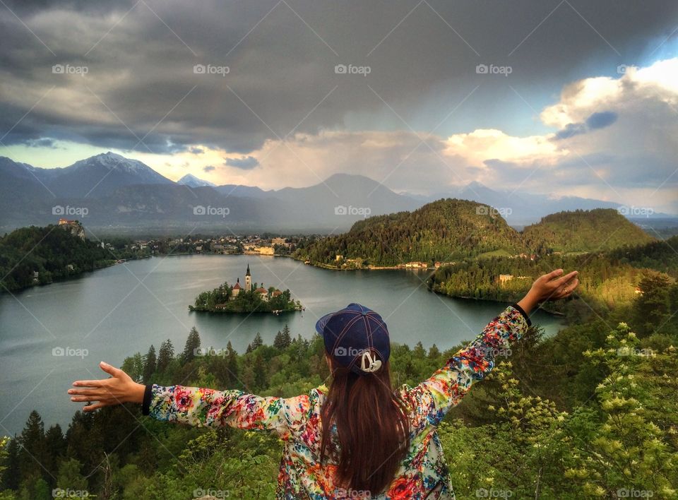 Rear view of woman standing on hill