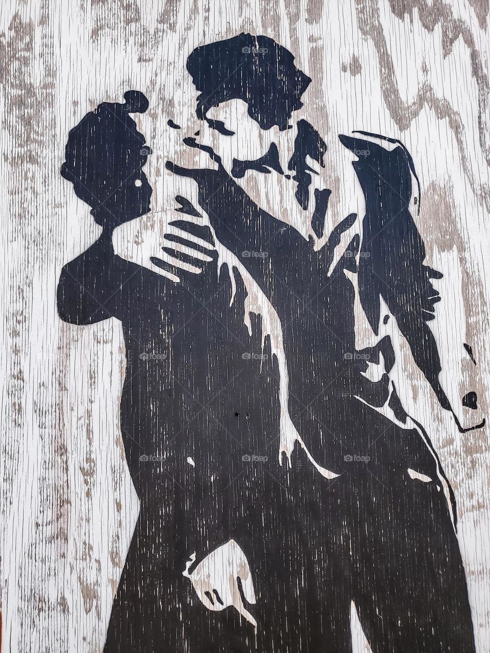 Outdoors mural of a couple kissing