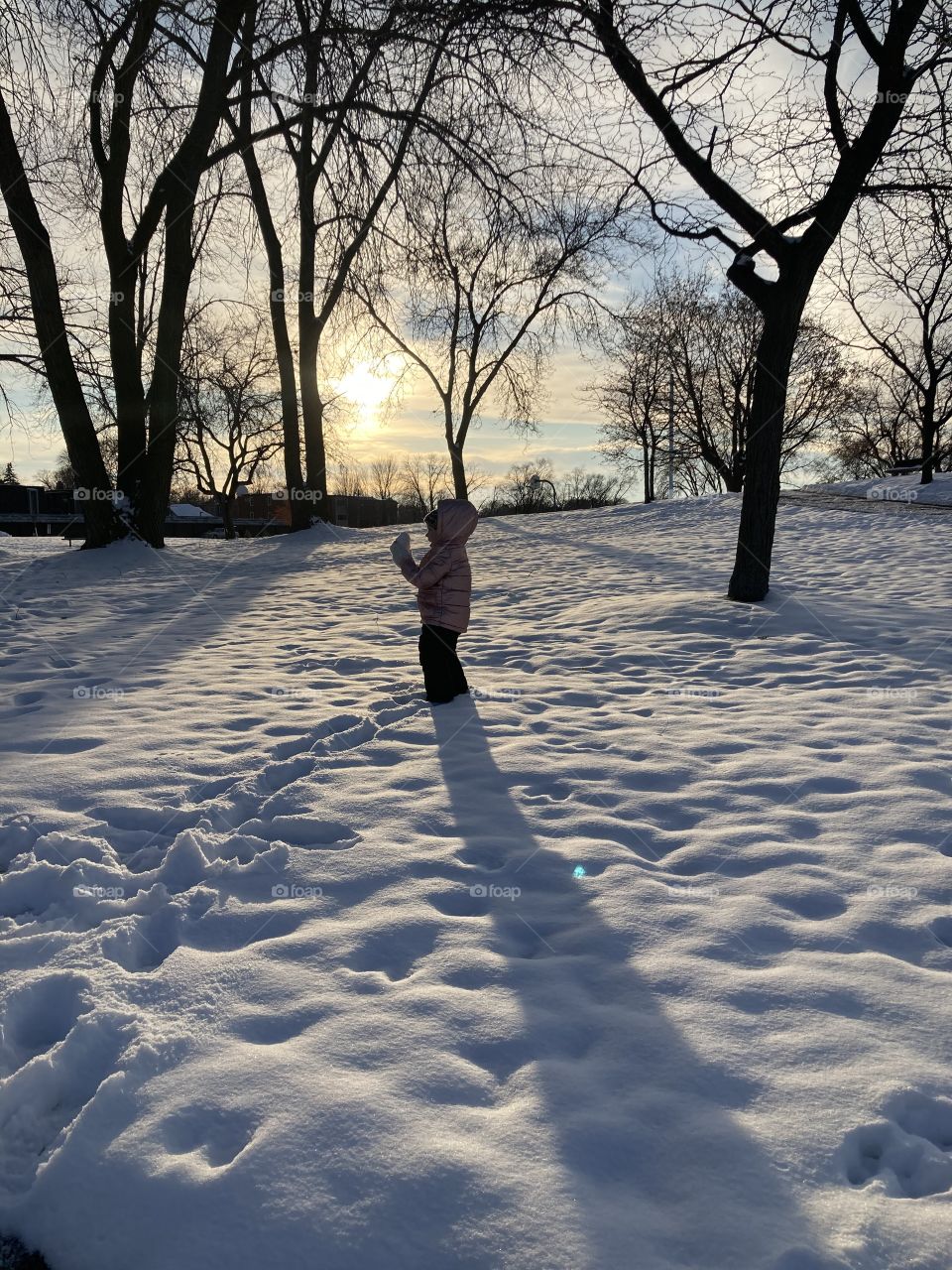 Toddler having fun in the snow