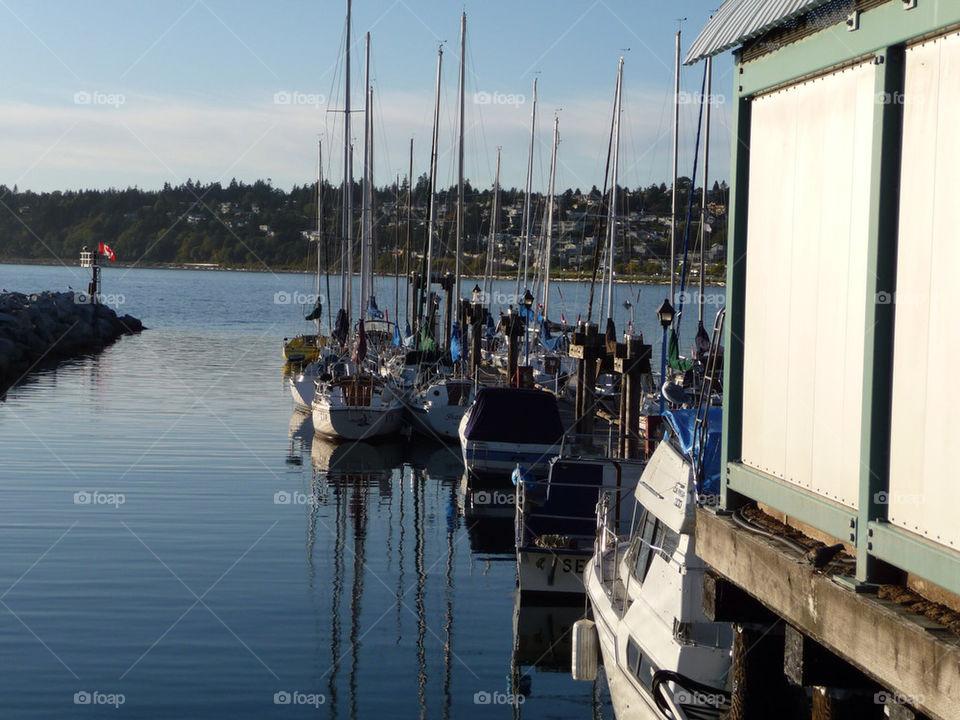 boat dock reflection sailboats by markworld
