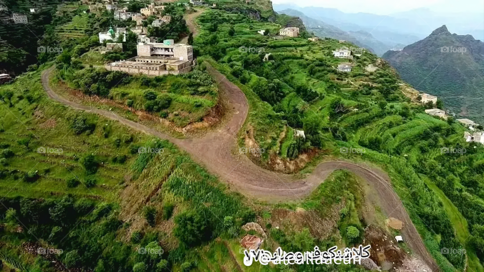 A stunning view of green mountains covered in fog in Yemen