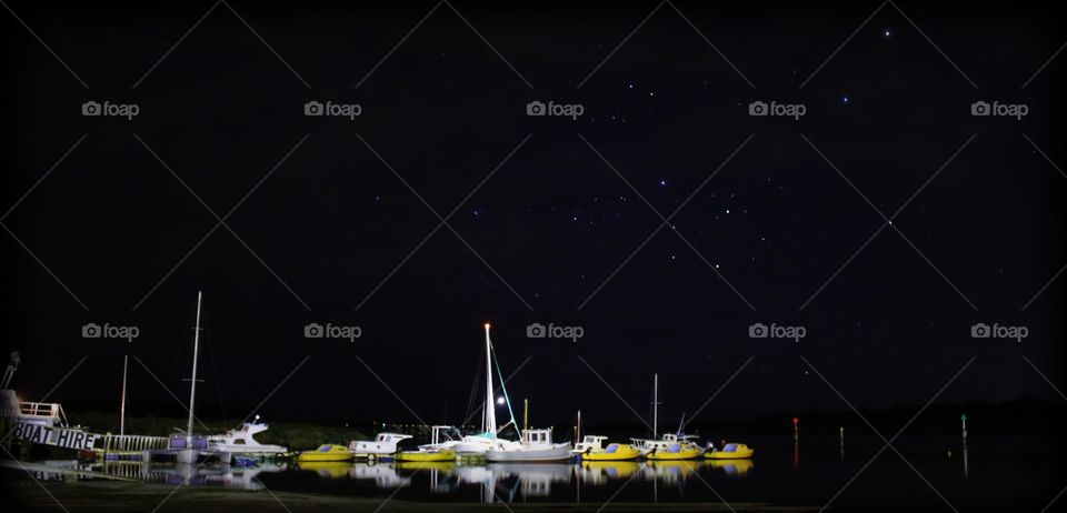 Boats under the night sky