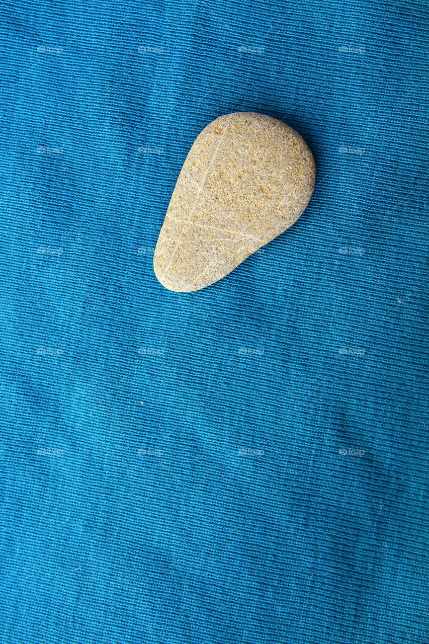 small stone on a textile background