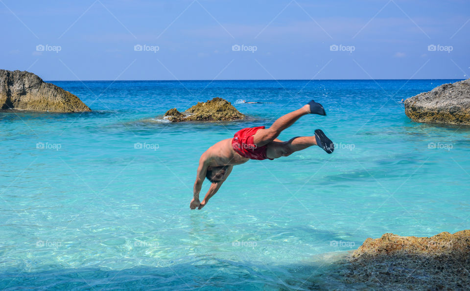 Young man diving in sea