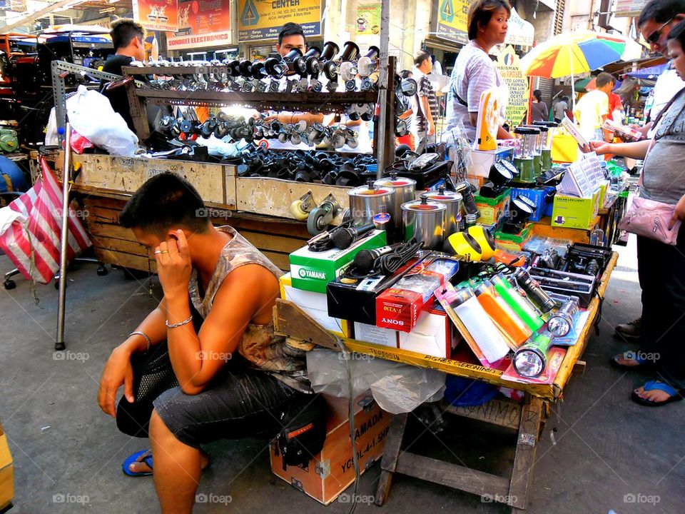 asian street vendor selling household and hardware items in quiapo, manila, philippines in asia