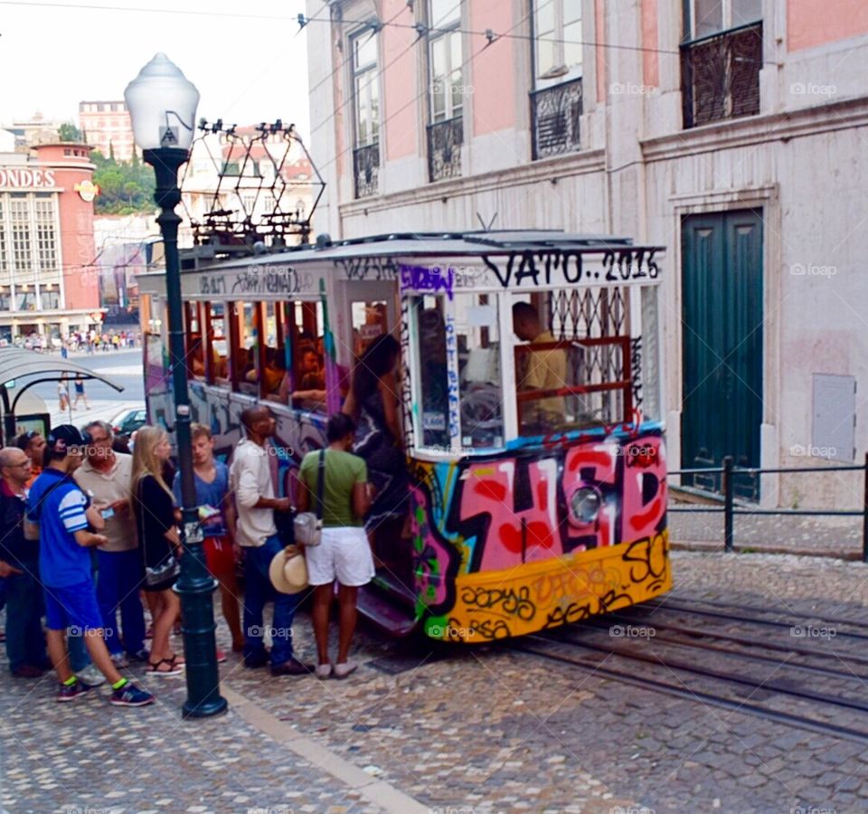 People getting on the tram