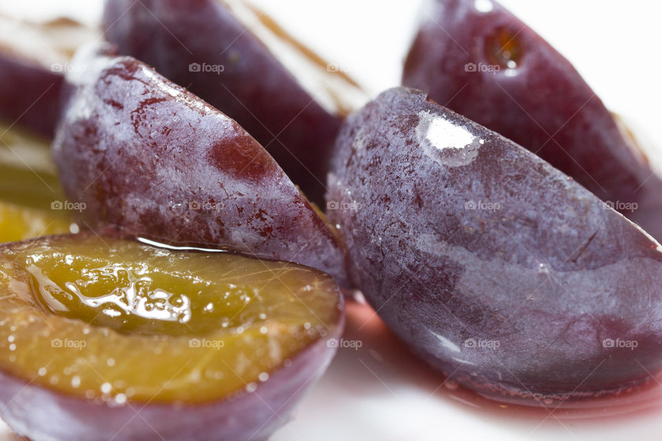 plum slices,  close up.  healthy eating and vegetarian  concept