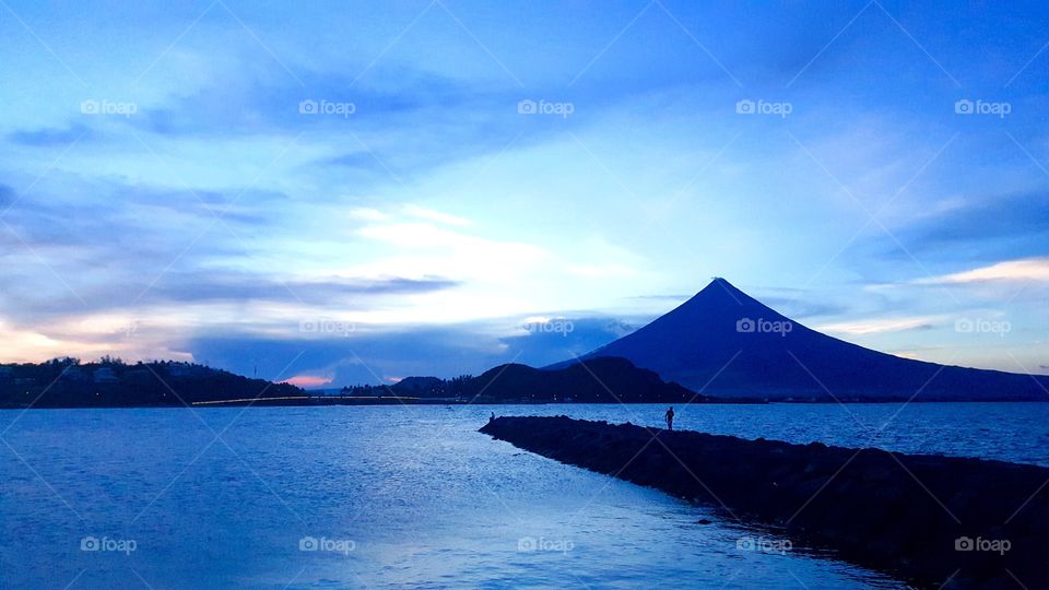 a shot of mayon volcano from the sea. This is the volcano with the most perfect cone despite several eruptions