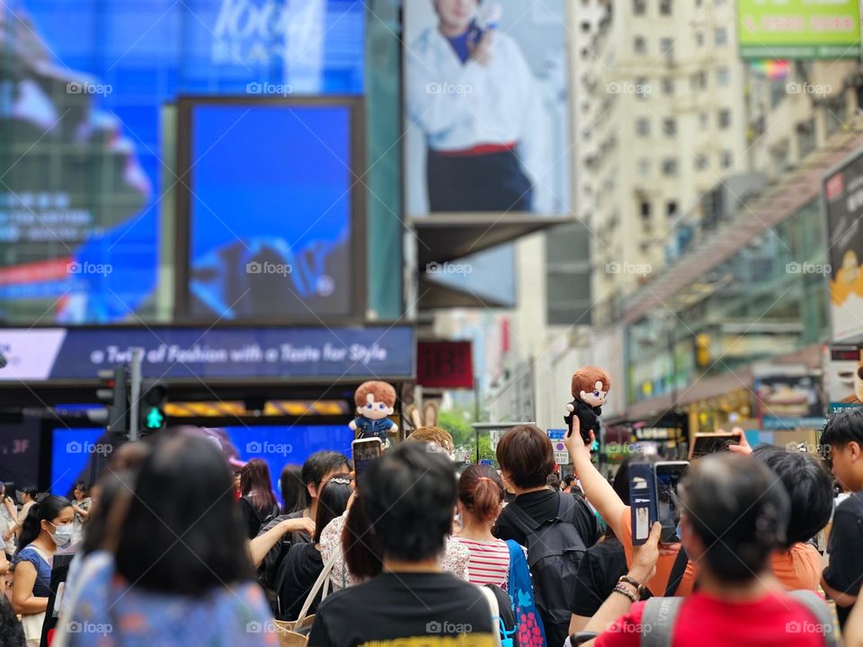 Fans going wild taking photos of their idol on the street