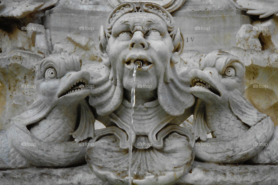 A closeup of a section of the Fontana del Pantheon in the Piazza della Rotonda in Roma, Italy. A photo digitized from an old 1993 film photo. 🇮🇹