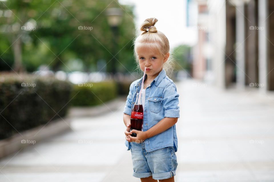 Portrait of little Caucasian girl feeling disgust 