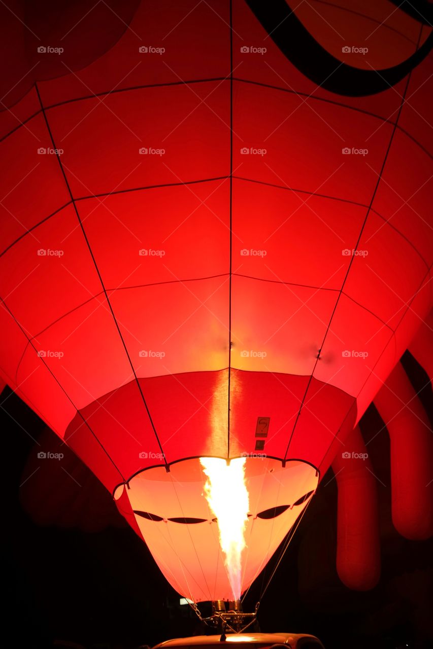 Red hot air balloon and flame of the balloon