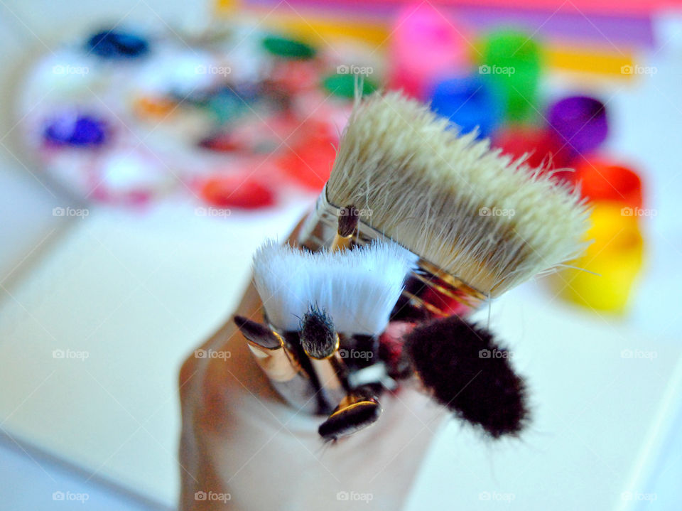 Art supplies, paintbrushes, paint, sketch book, watercolor pad, palette, paintbrush close-up