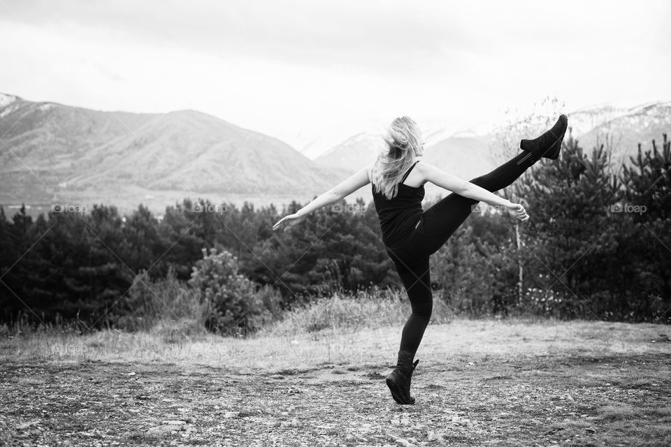 girl dancing on the mountain