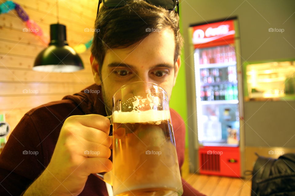 man drinking beer