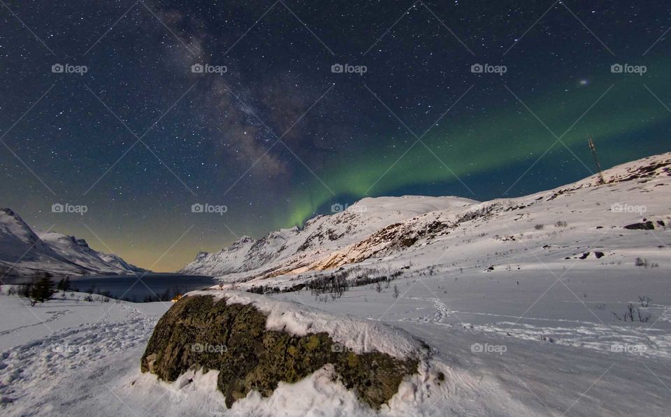 Two of the most incredible natural phenomena one can observe in the night right over the breathtaking Norwegian fjords