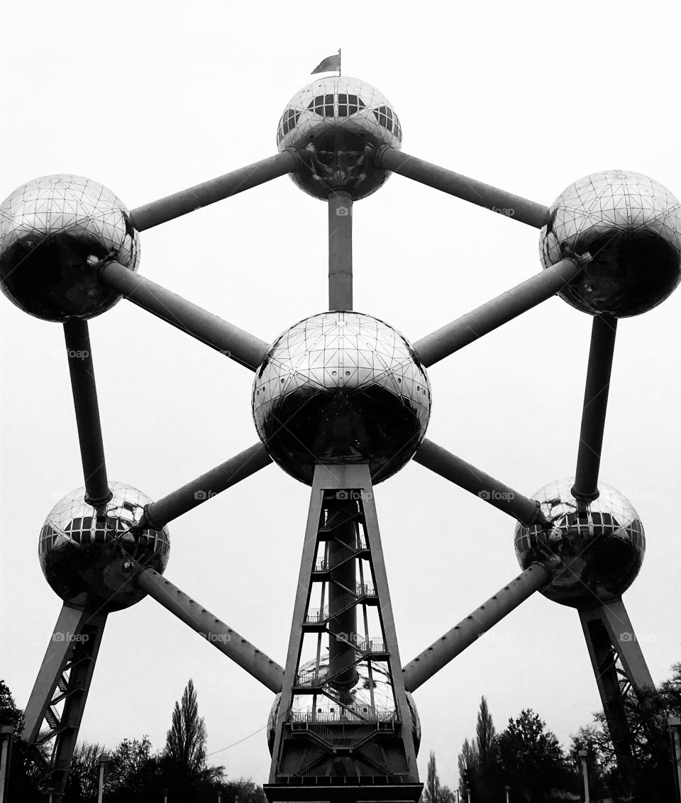 the belgium’s most famous monument:Atomium.Here captured during the Albanian national day (see the Albanian flag up above) and in black and white